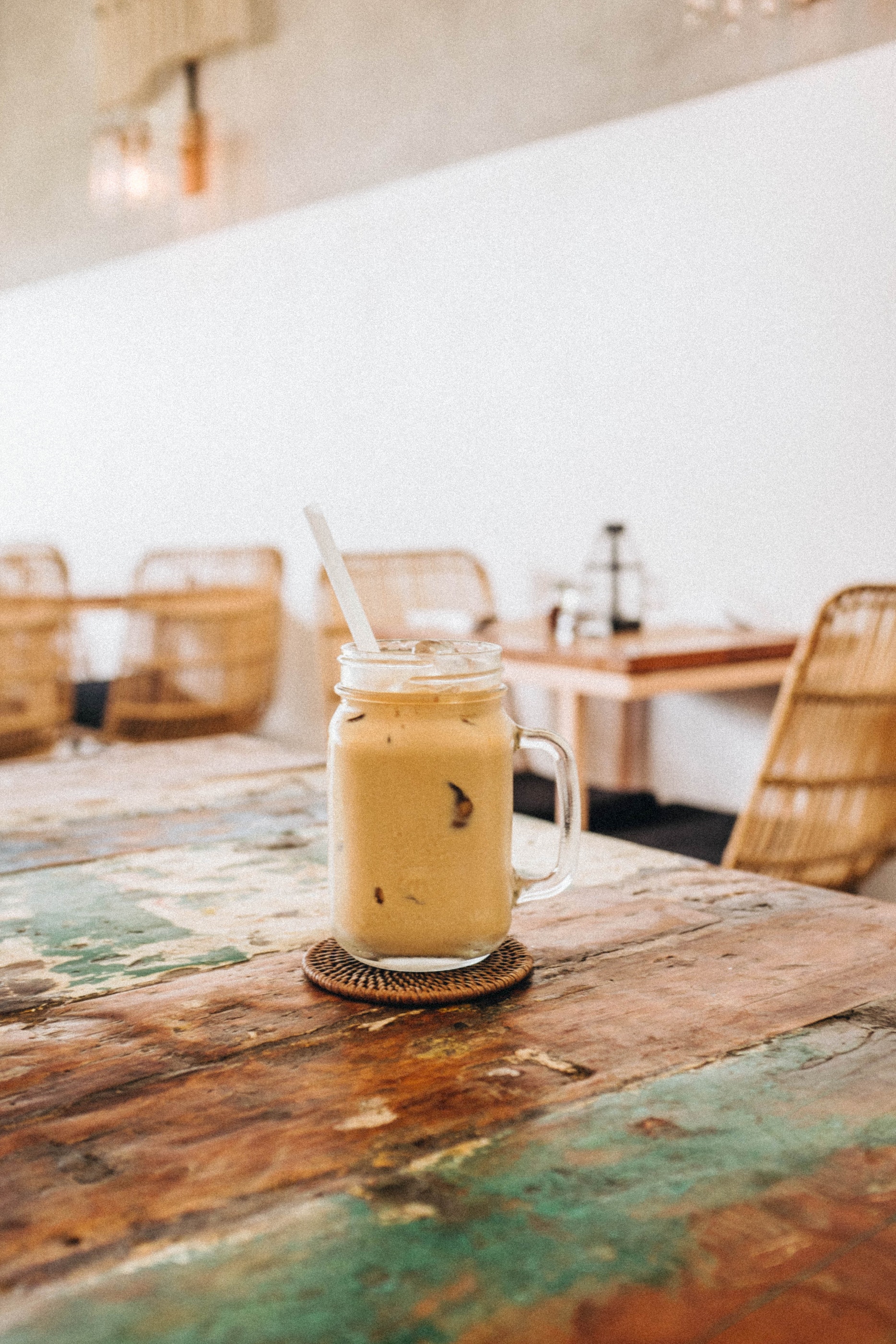 iced coffee with straw in mason jar